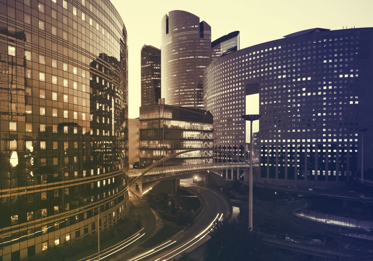 Office buildings in Paris business district La Defense. Sskyscrapers glass facades. Modern urban architecture, economy, finances, business activity concept.